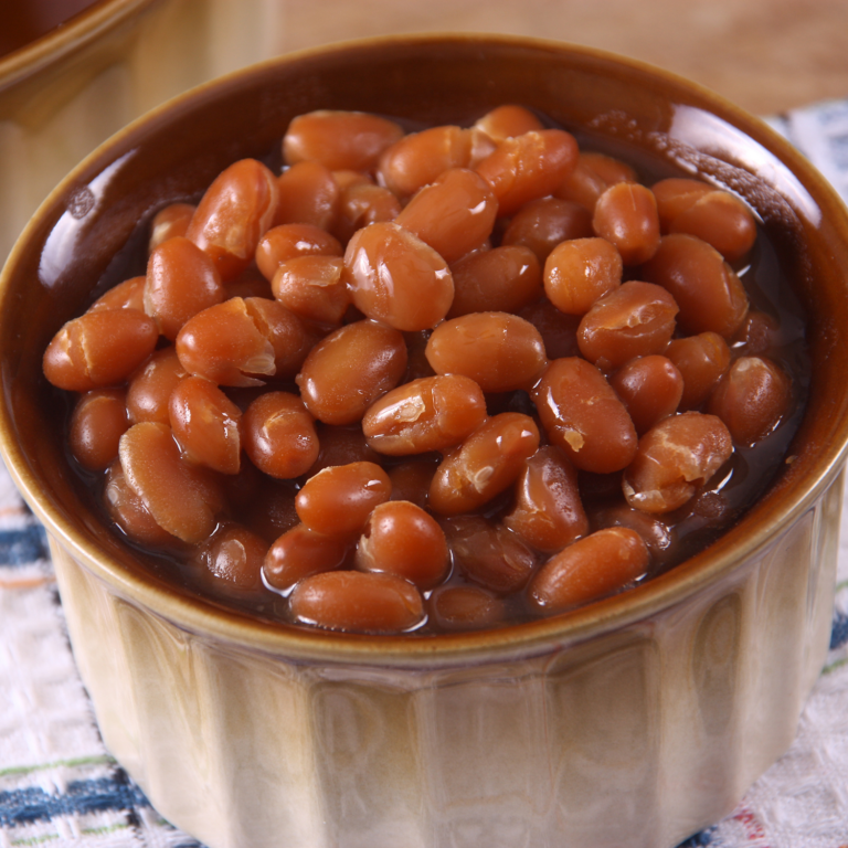 Ceramic dish filled with maple baked beans