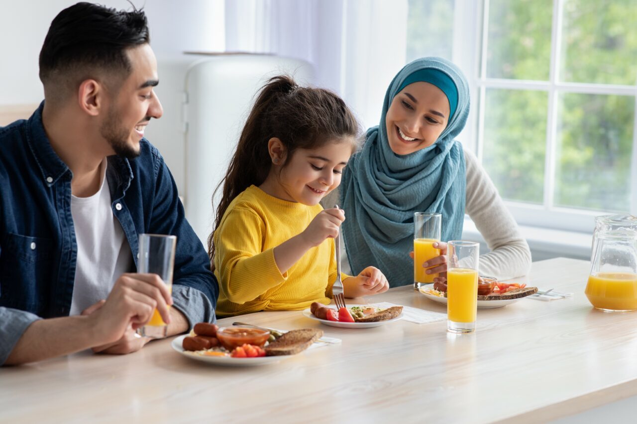 Family of three eating dinner